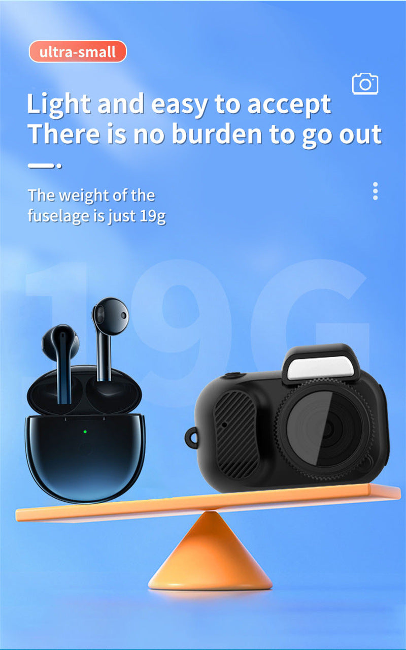 Black camera case and earbuds on a balance scale with text about weight on a blue background