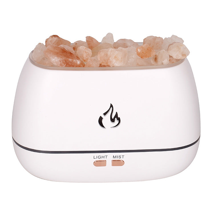 White diffuser with pink Himalayan salt crystals on a white background