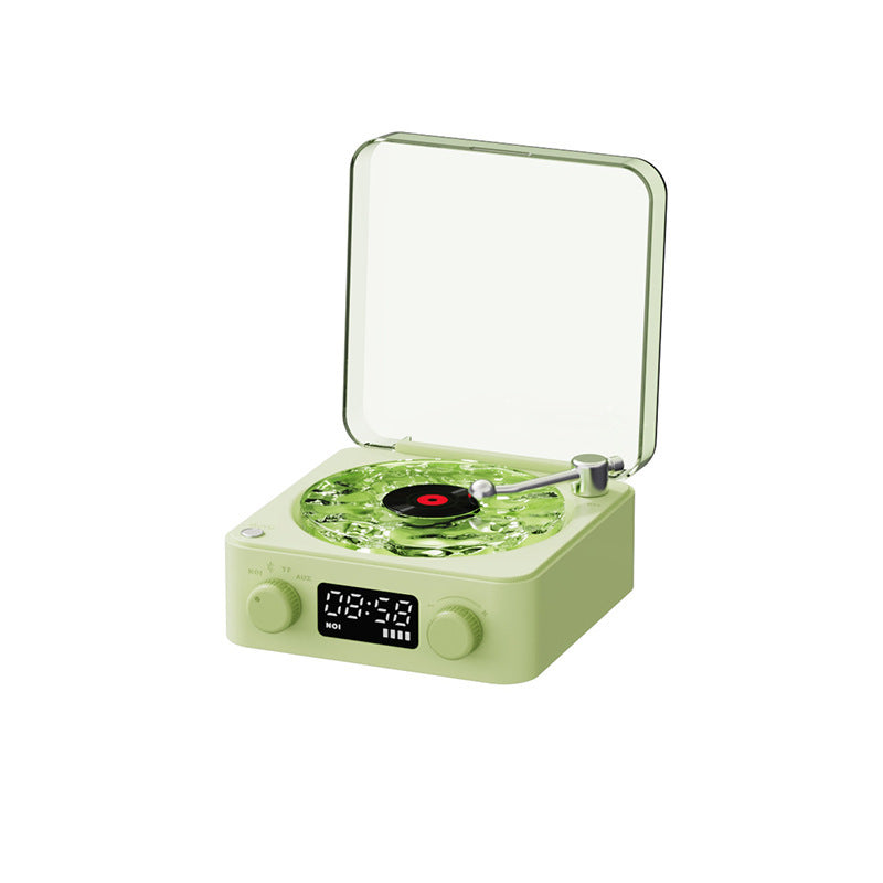 Green record player with digital display on a white background