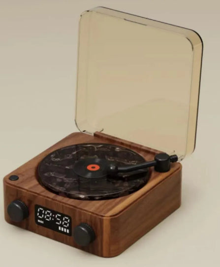 Wooden record player with a transparent lid on a beige background