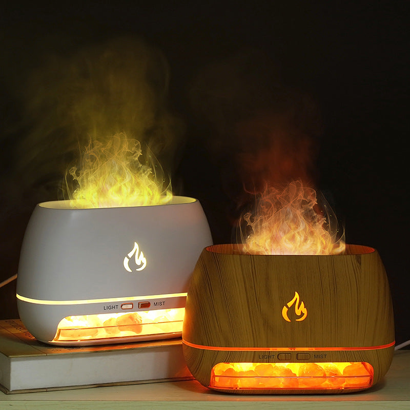 Two flame-themed diffusers, one white and one wooden, on a dark background.