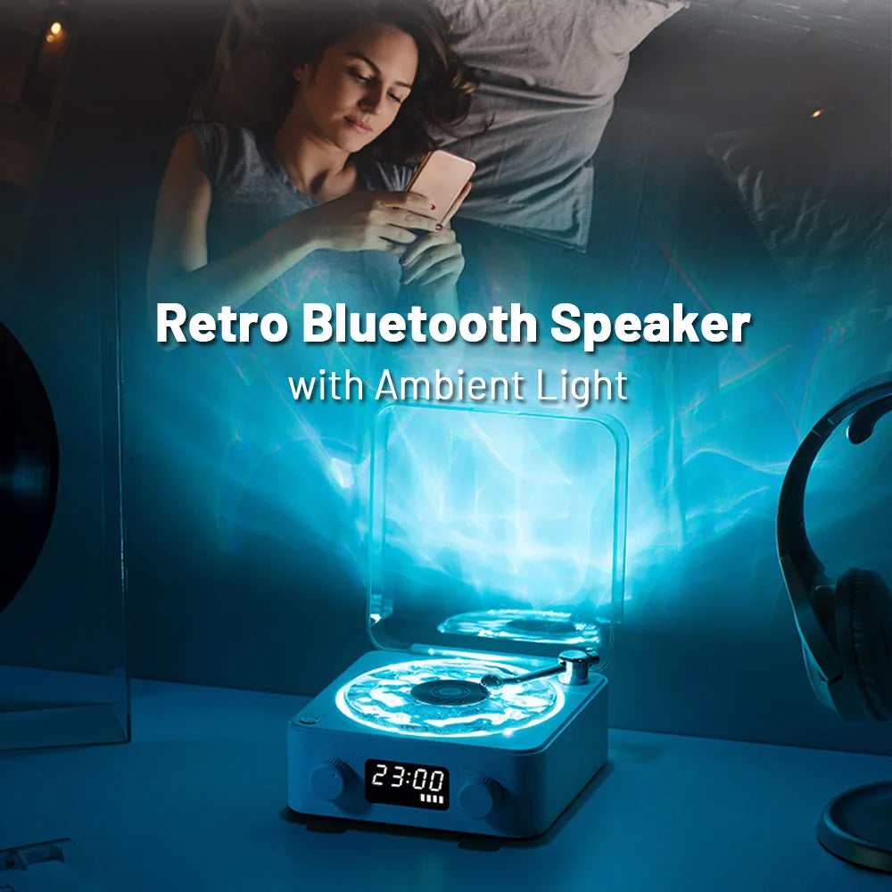 Retro Bluetooth speaker with ambient light on a table, with a person using a phone in the background.